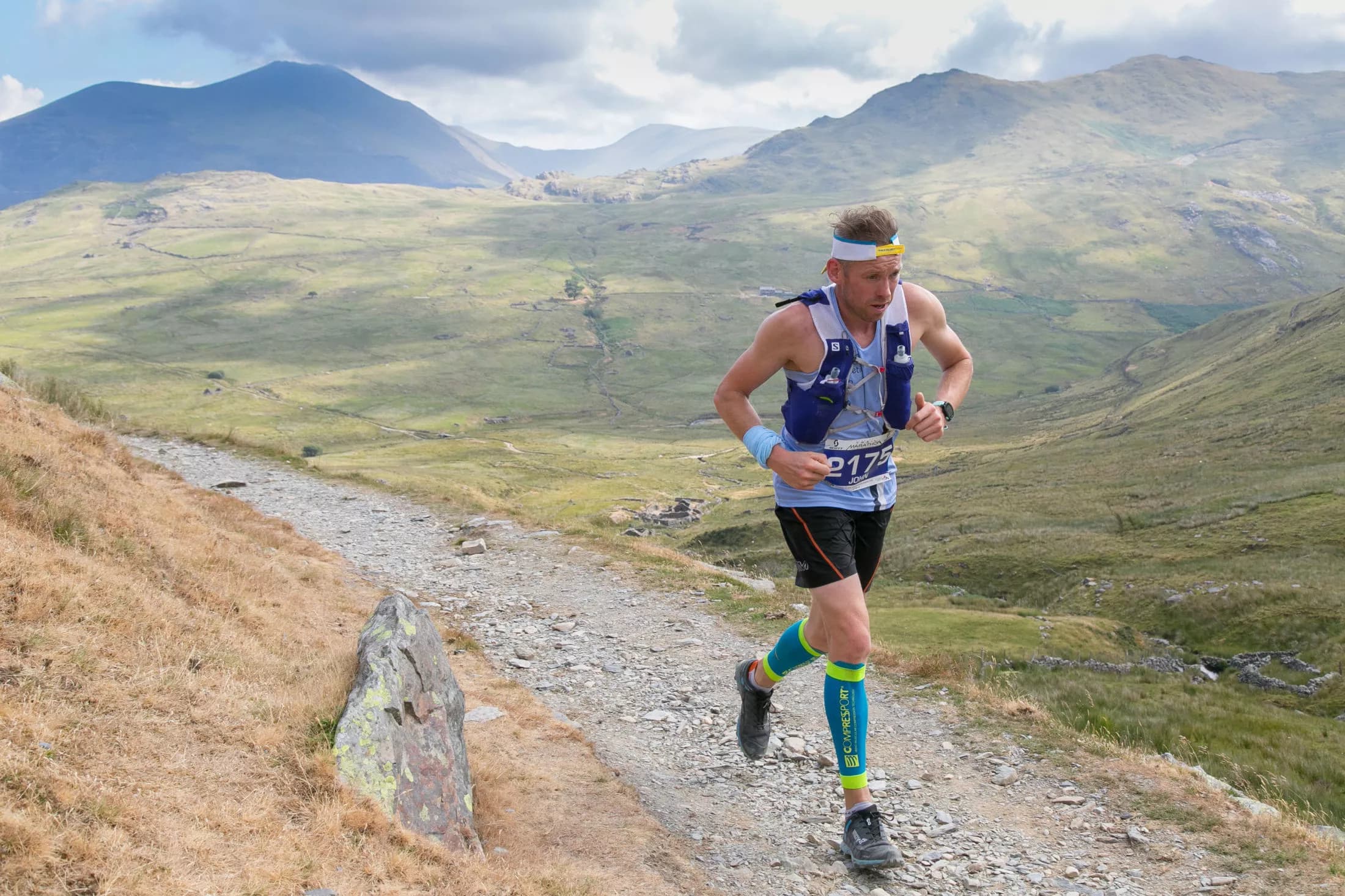Runner racing on a mountain trail