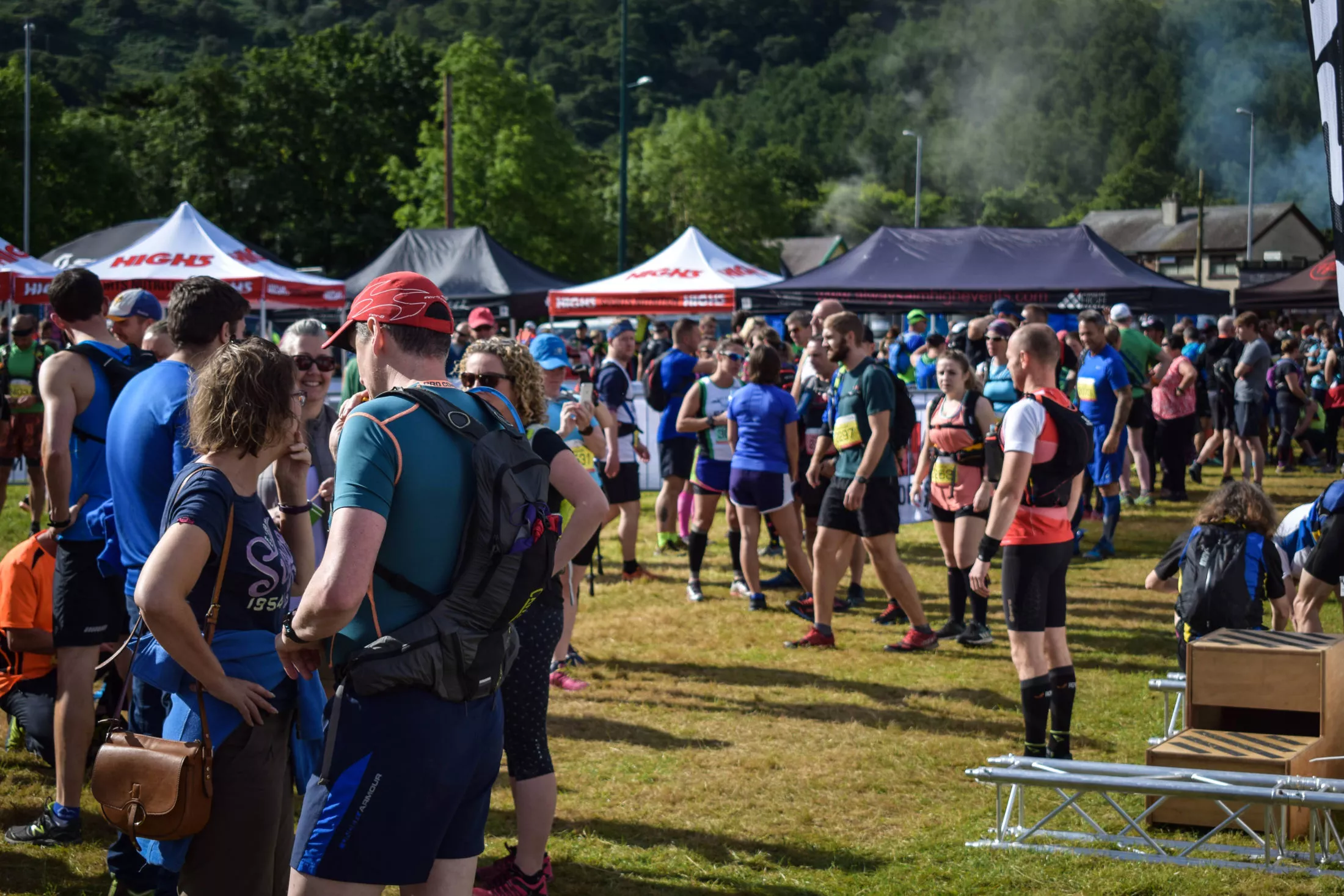 Runners gathered at a race village on event day